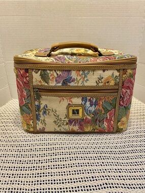 Vintage Leisure Luggage train case features a floral pattern colorful tapestry
